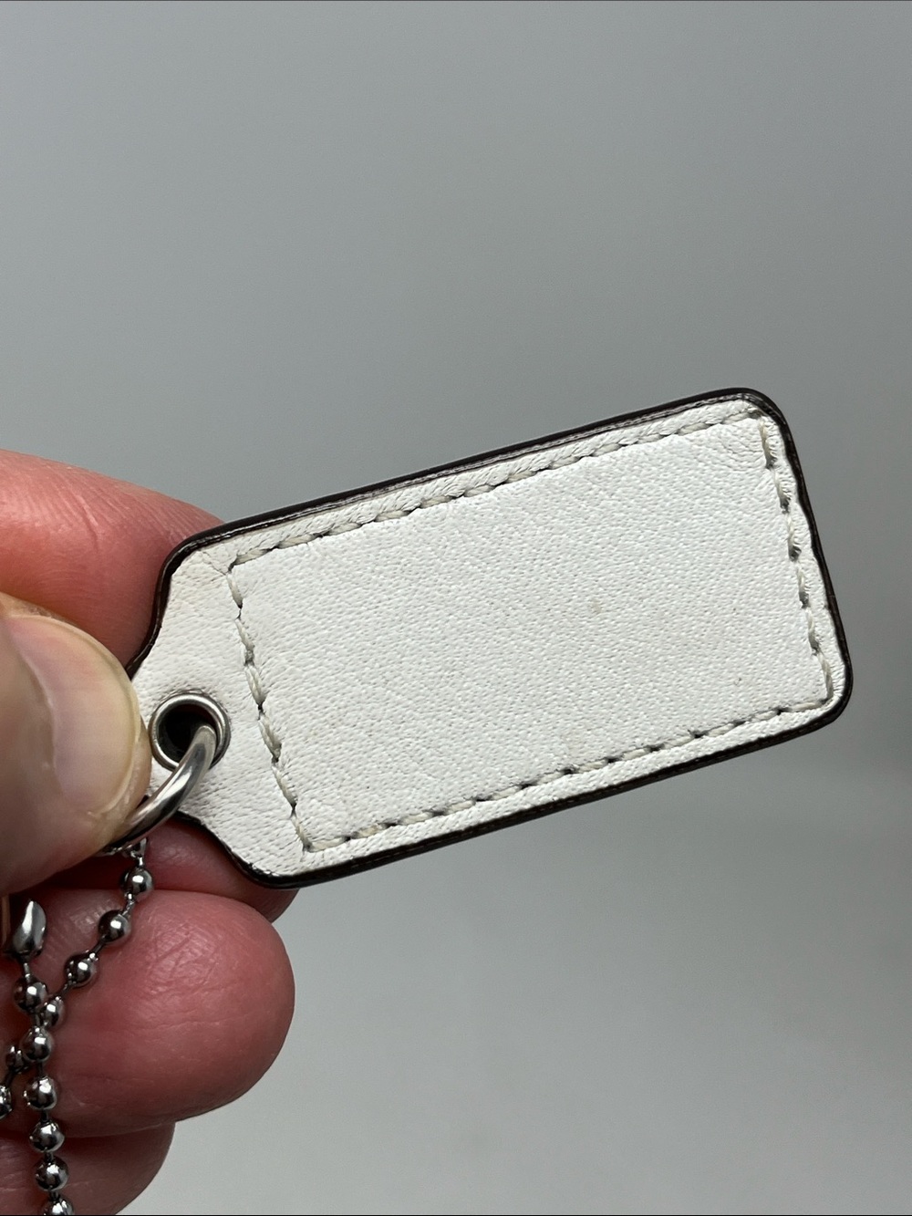 COACH HANG TAG WHITE AND SILVER WITH BONUS PINK SPARKLE MATTE SILVER KEYCHAIN - Picture 3 of 11